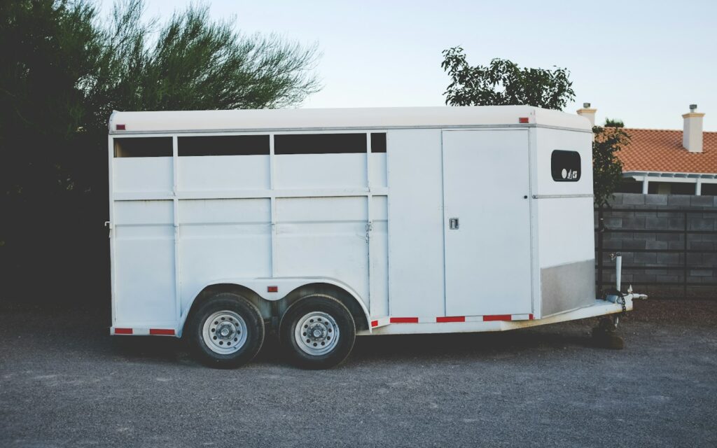 White enclosed trailer of the kind used to haul pressure washing equipment